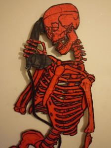 A red skeleton on the telephone