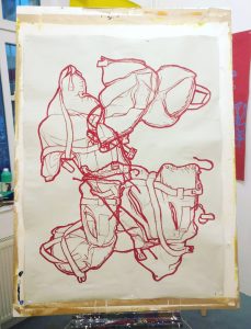 Drawing of a children's life jacket. Red oil pastel on light grey Gu